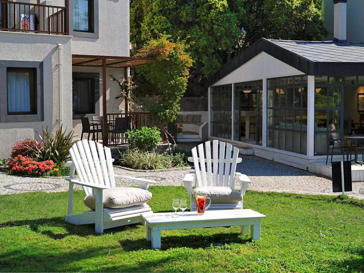 Отель Dorman Suites Битез